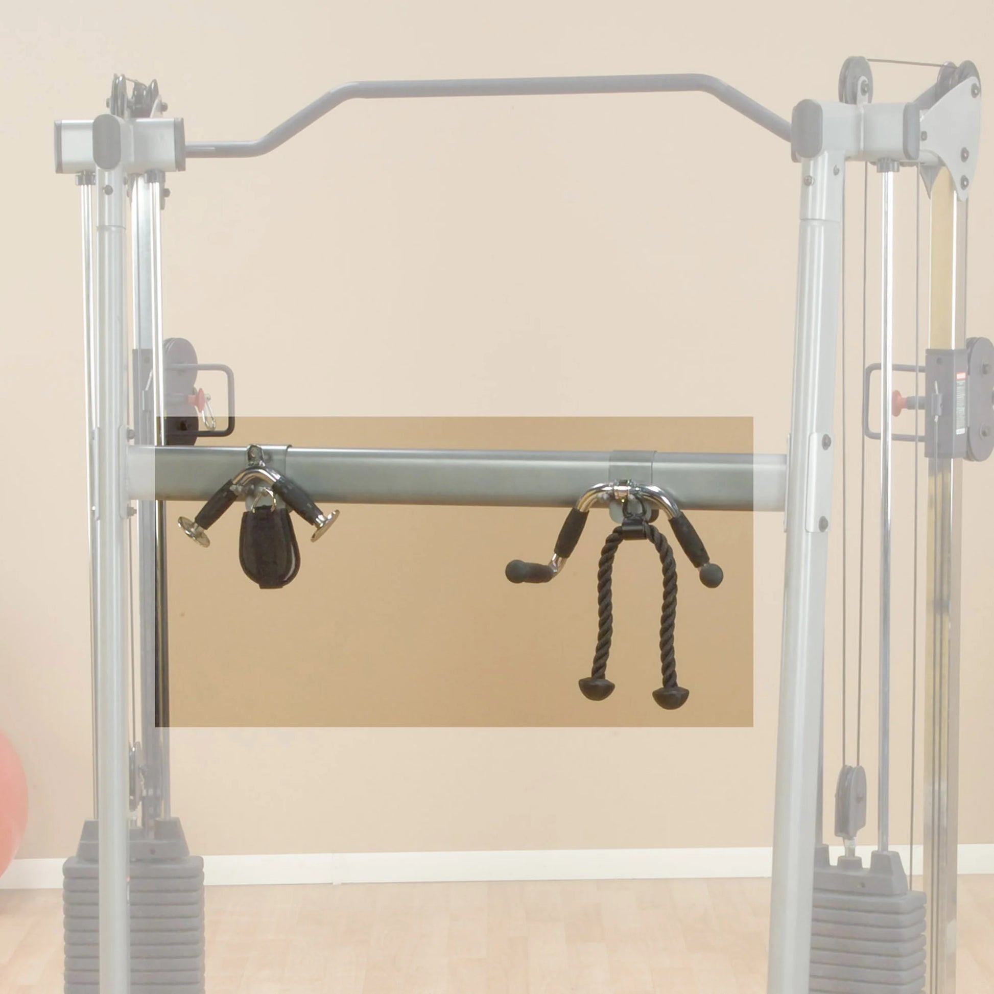 Functional trainer gym equipment with black rope attachment.
