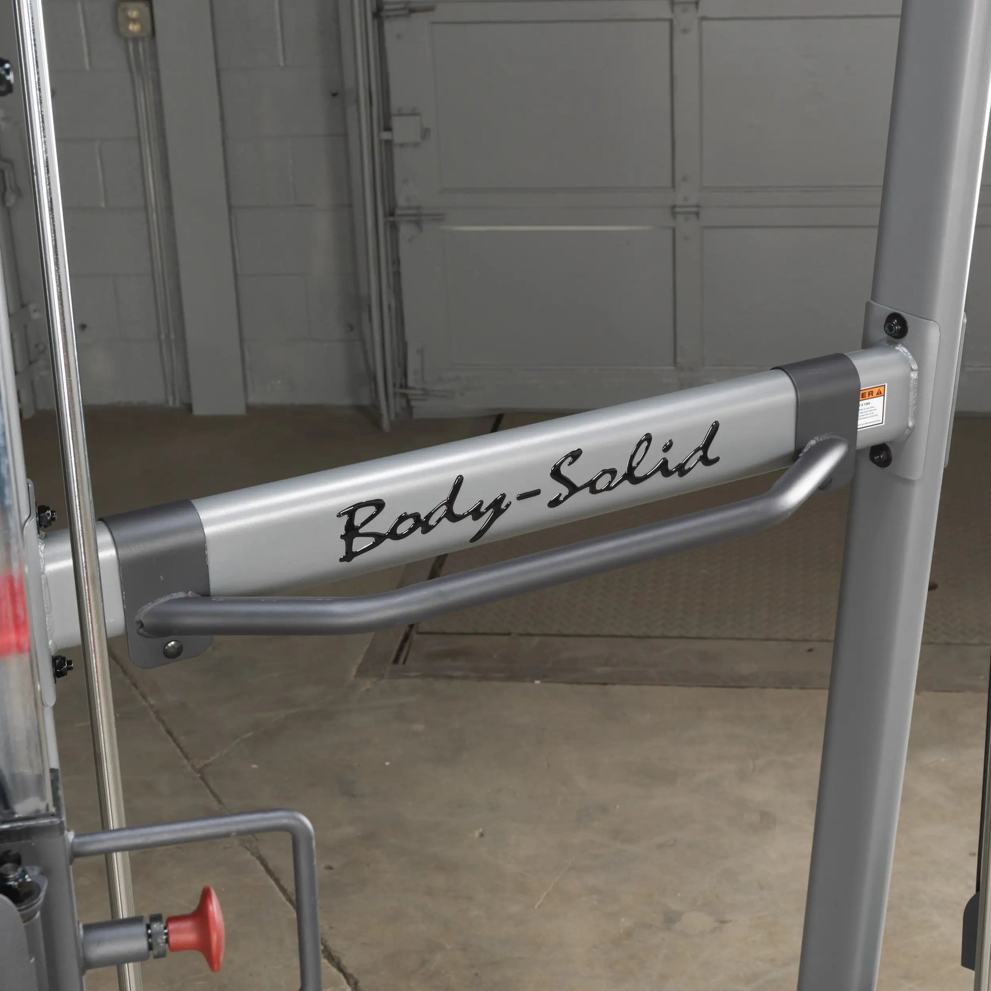 Body-Solid weight machine arm in sleek gray finish for gym use.