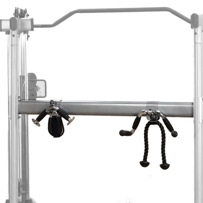Gym cable machine with adjustable pulleys and black rope handle, perfect for versatile workouts.