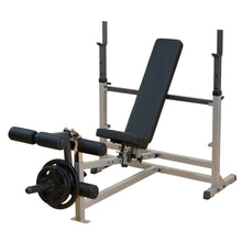 Adjustable weight bench with black padding and leg extension feature for strength training.