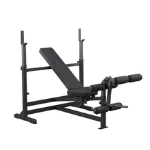 Adjustable weight bench with leg developer, black steel frame, ideal for home gym workouts.