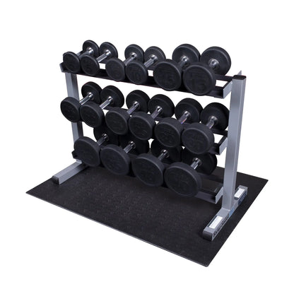Rubber dumbbells on a three-tier rack, featuring weights from 5 to 30 pounds.
