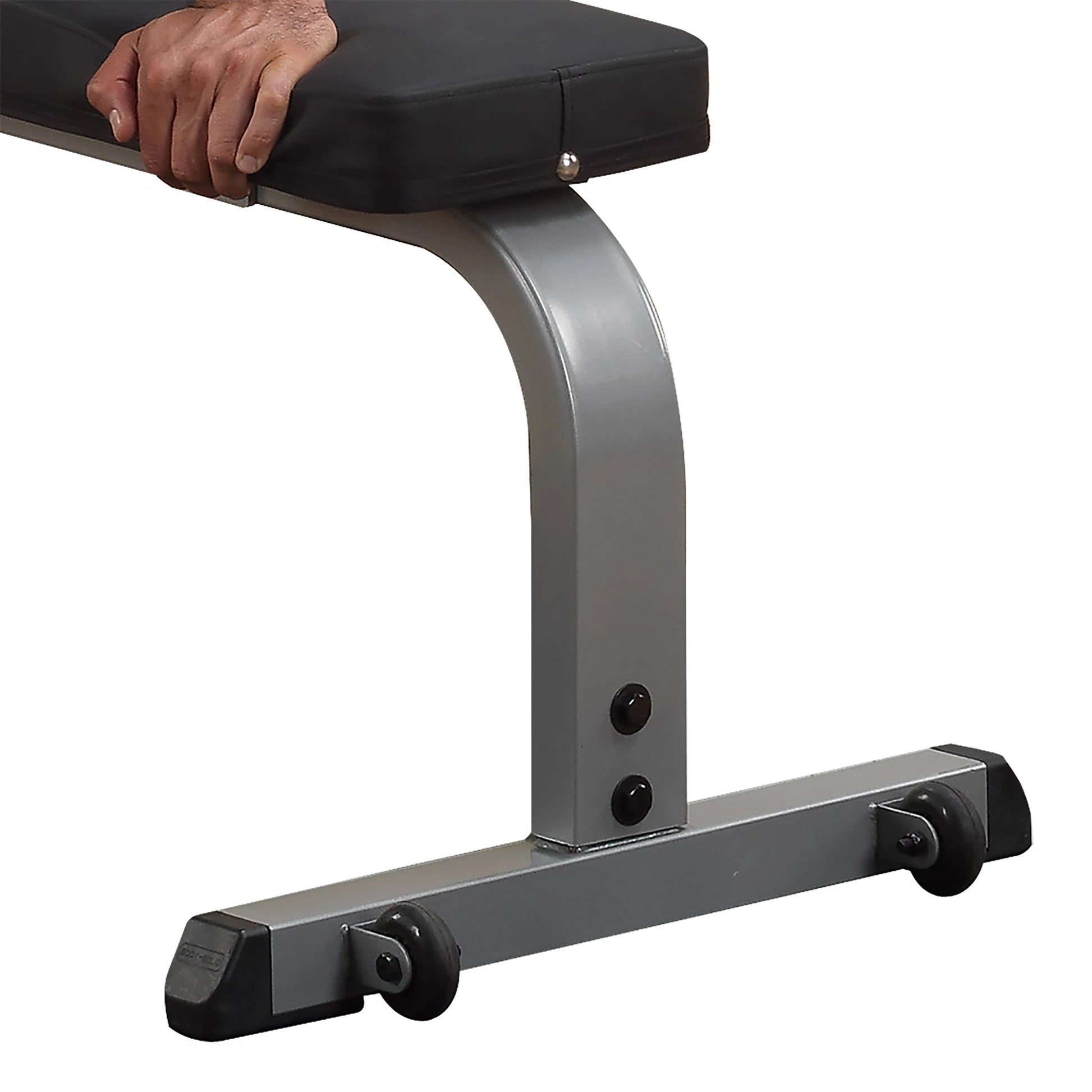 Adjustable weight bench with black cushion and silver frame, featuring built-in transport wheels.