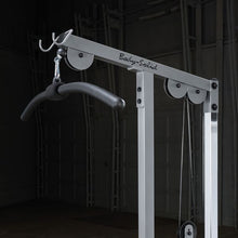 Body-Solid cable machine with black curved handle for gym workouts.