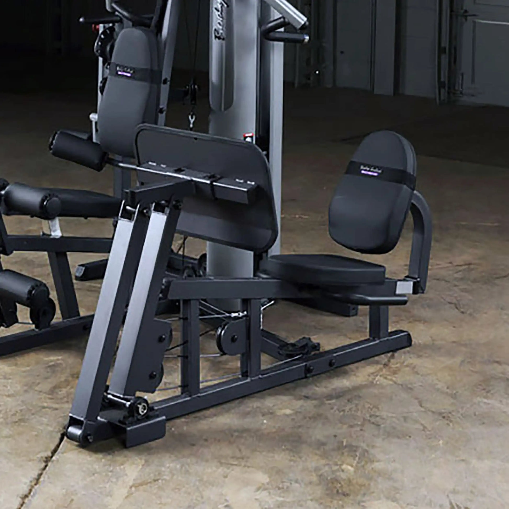 Body-Solid leg press machine in sleek black finish, ideal for home gym workouts.