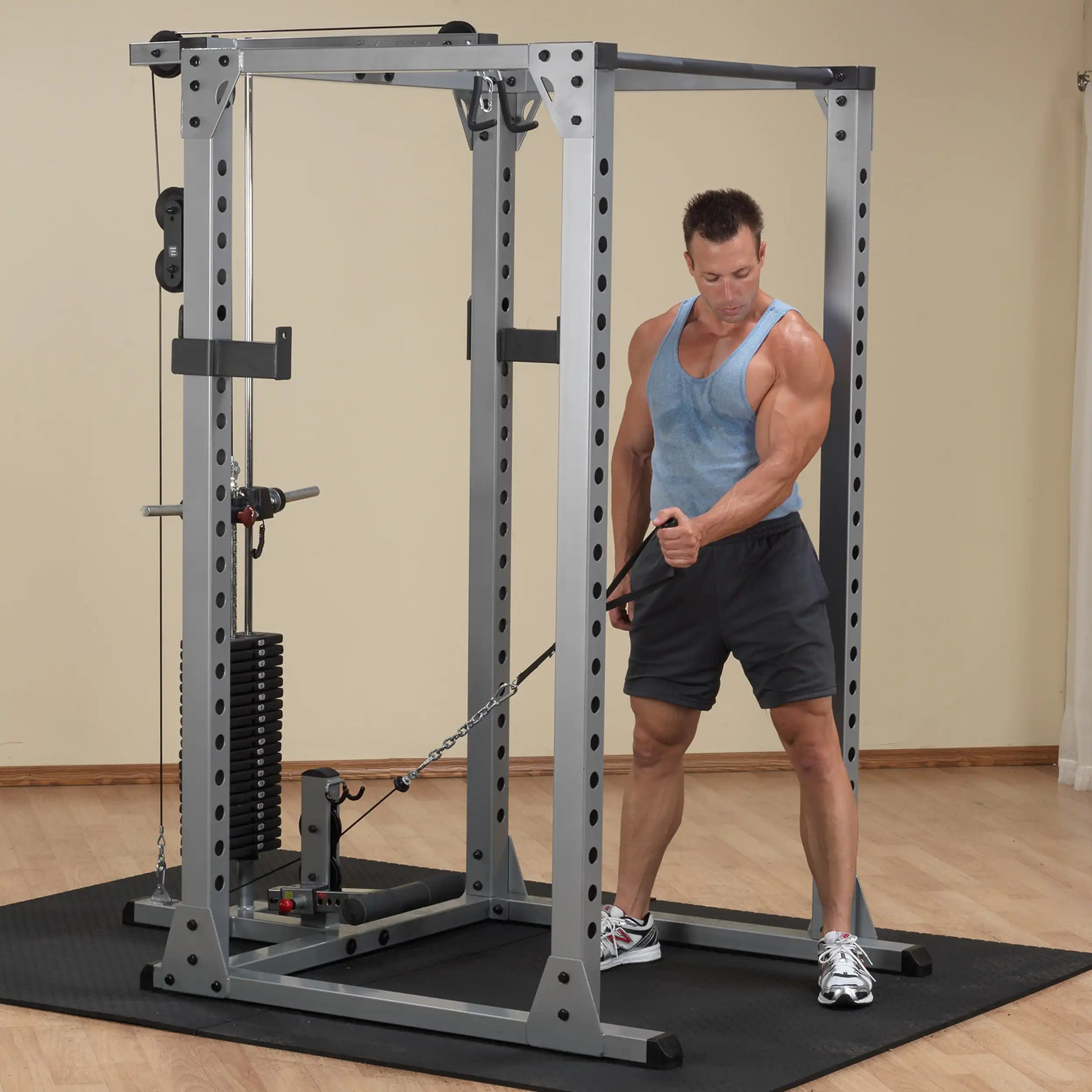 Man using Powerline Smith Machine for cable workout in home gym.