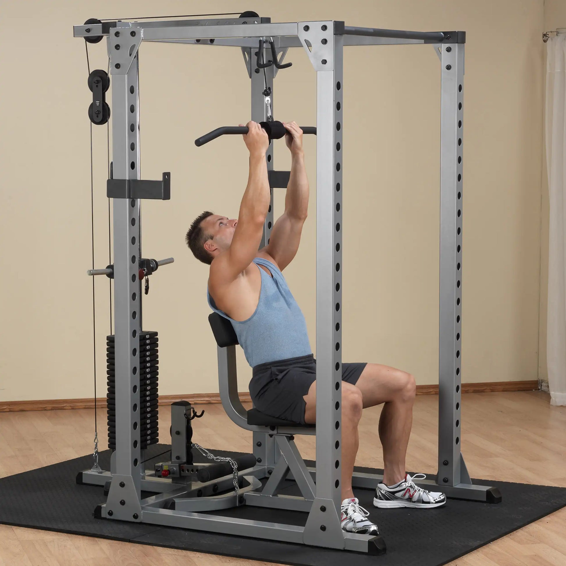 Man using a Body-Solid Powerline Home Gym for upper body workout.