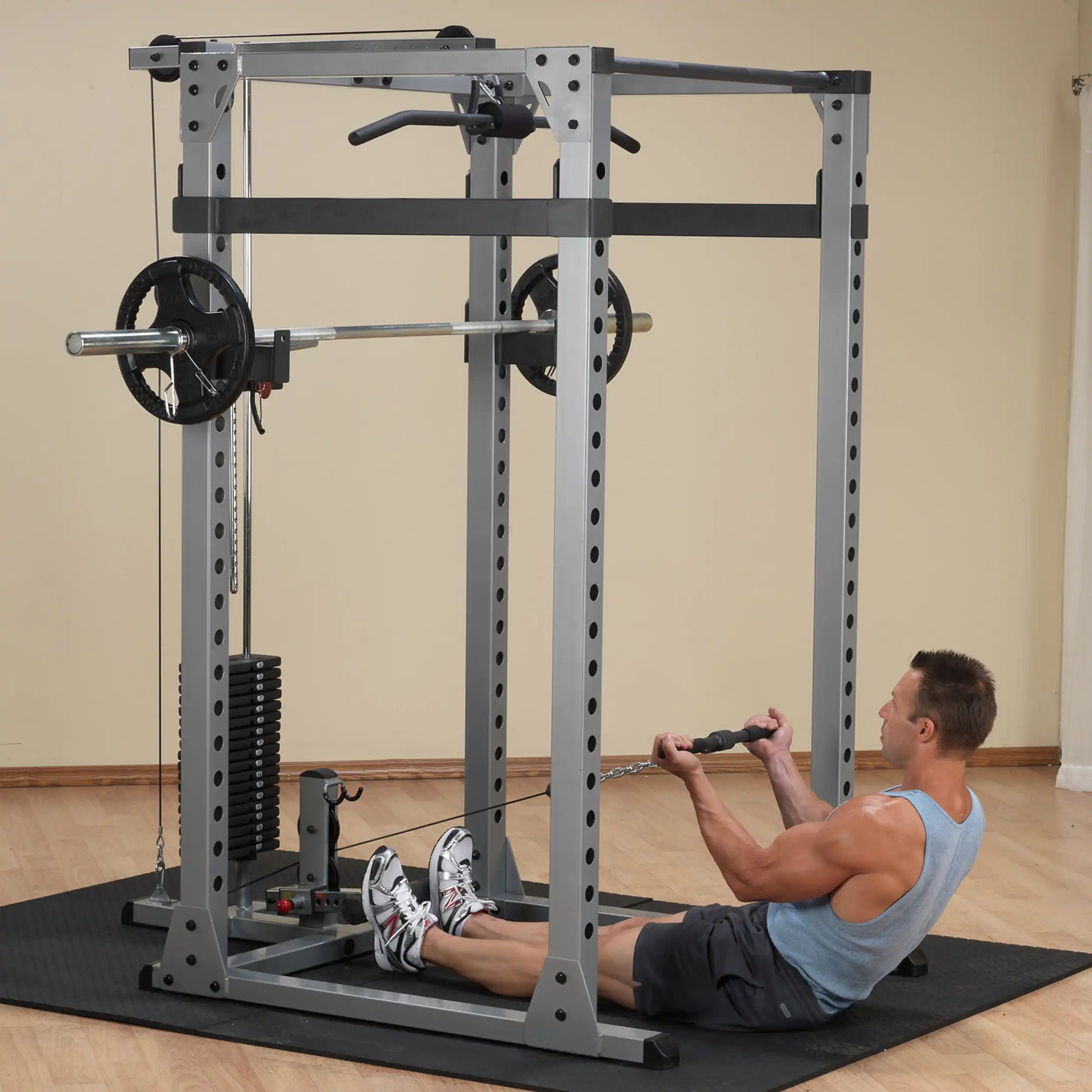 Man using a Marcy Smith Cage machine for seated rows in a home gym.