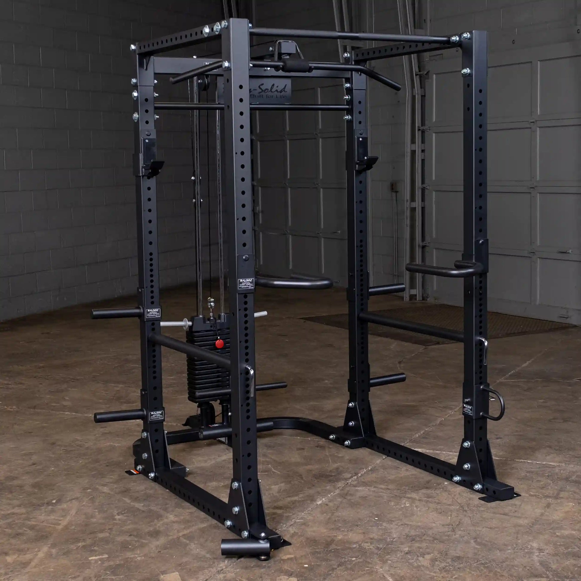 Body-Solid power rack with weight stack in black for home gym strength training.