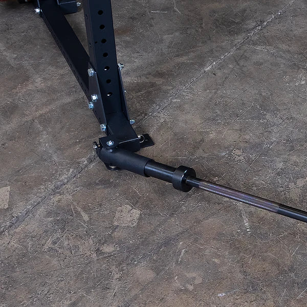 Landmine attachment on a black power rack for weightlifting.