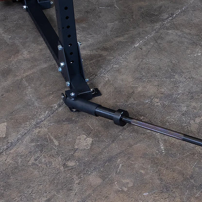 Landmine attachment on a black power rack for weightlifting.
