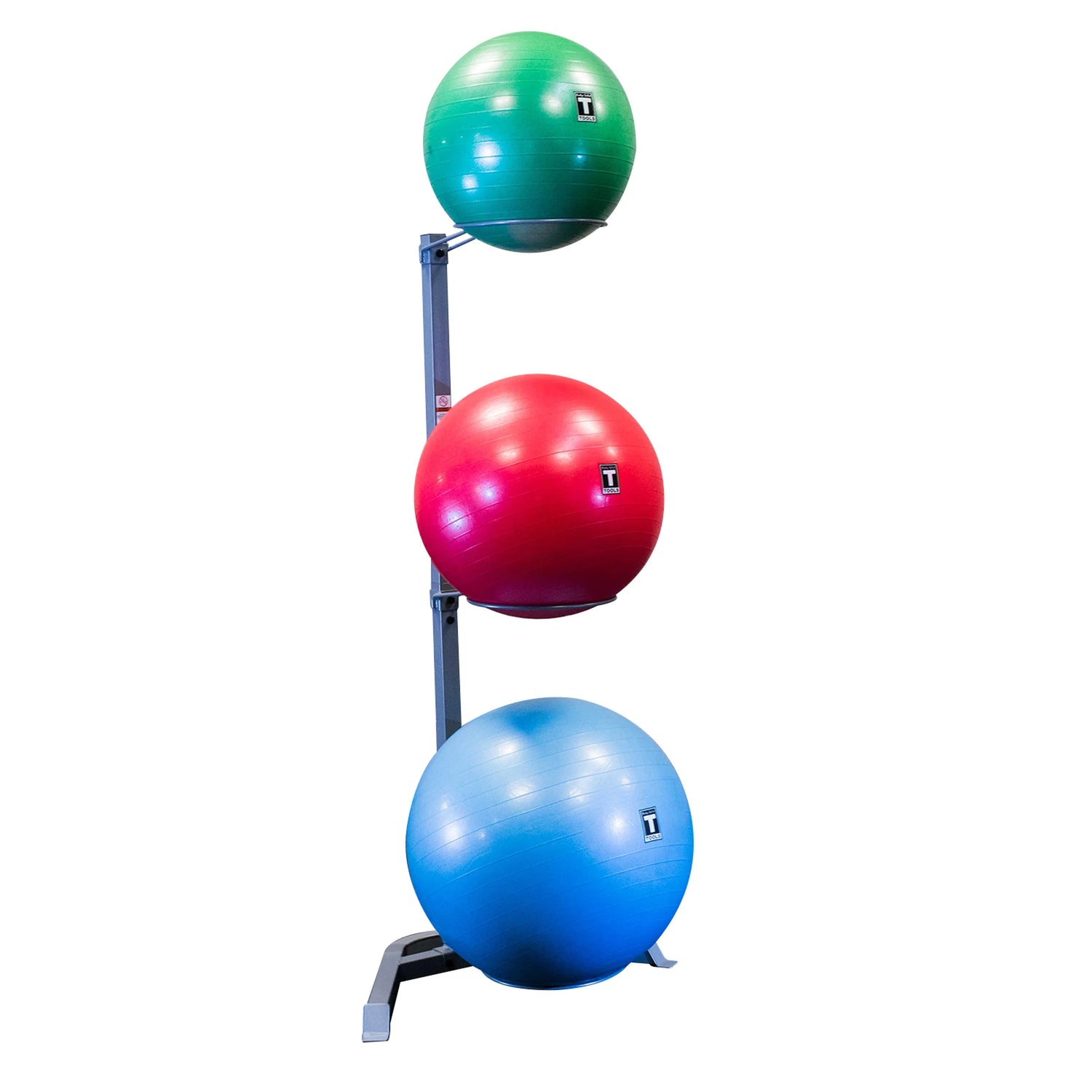 Three TKO stability balls in green, red, and blue on a vertical stand.