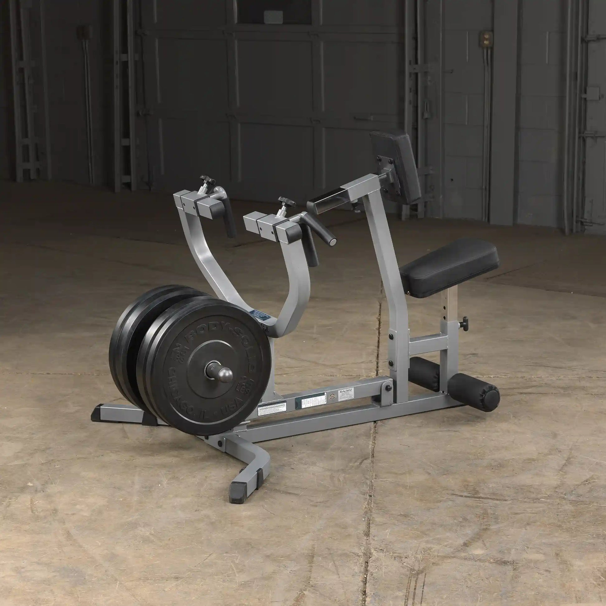 Body-Solid seated row machine with weight plates, gray color, ideal for strength training in home gyms.