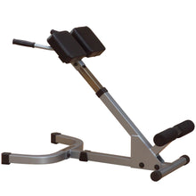 Adjustable exercise equipment for back extensions, featuring padded support and a sturdy metal frame.