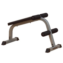 Powerline workout bench with a padded black seat and foam rollers, designed for strength training exercises.
