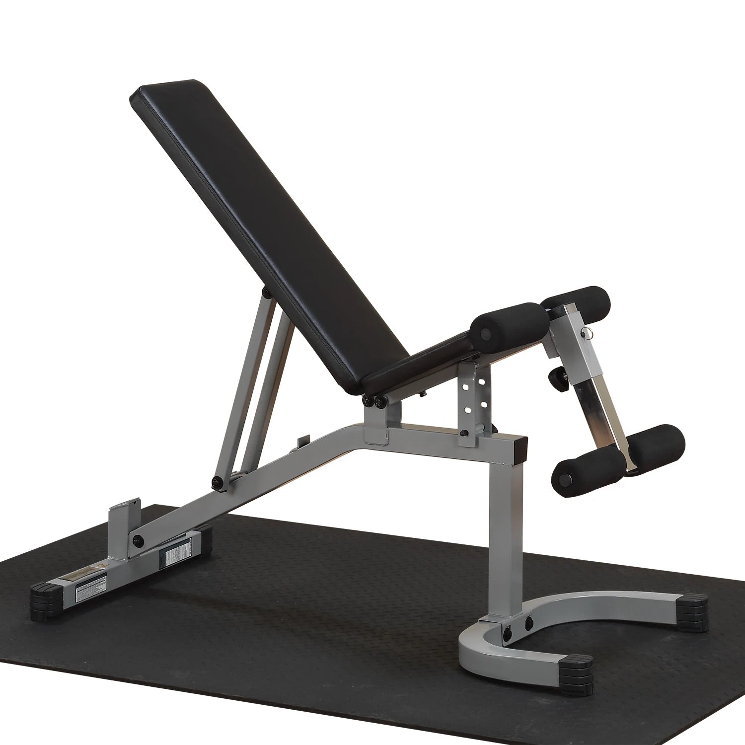 Adjustable weight bench with a black padded seat and gray metal frame, positioned on a black rubber gym mat.