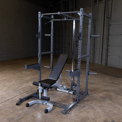 A multi-functional gym equipment setup featuring a squat rack, adjustable bench, and cable pulley system, set against a plain background in a spacious gym environment.