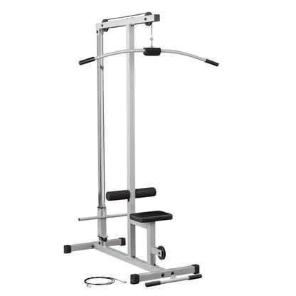 A silver and black cable machine for strength training, featuring a curved handle, adjustable seat, and padded rollers, with a cable lying on the floor beside it.