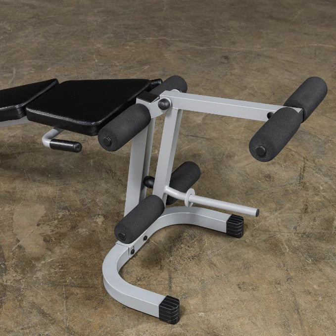 A close-up view of an adjustable gym bench with black padding and gray metal frame, designed for strength training exercises.