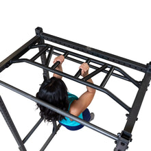 A person performing a pull-up on a black exercise rack, viewed from above, showcasing their hands gripping the bars and their muscular arms.