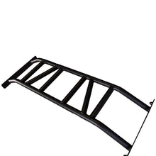 A black metal ladder frame with a series of crossbars, designed for structural support or vehicle modification.