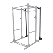 A sturdy black power rack designed for strength training, featuring multiple adjustable pull-up bars and safety hooks.