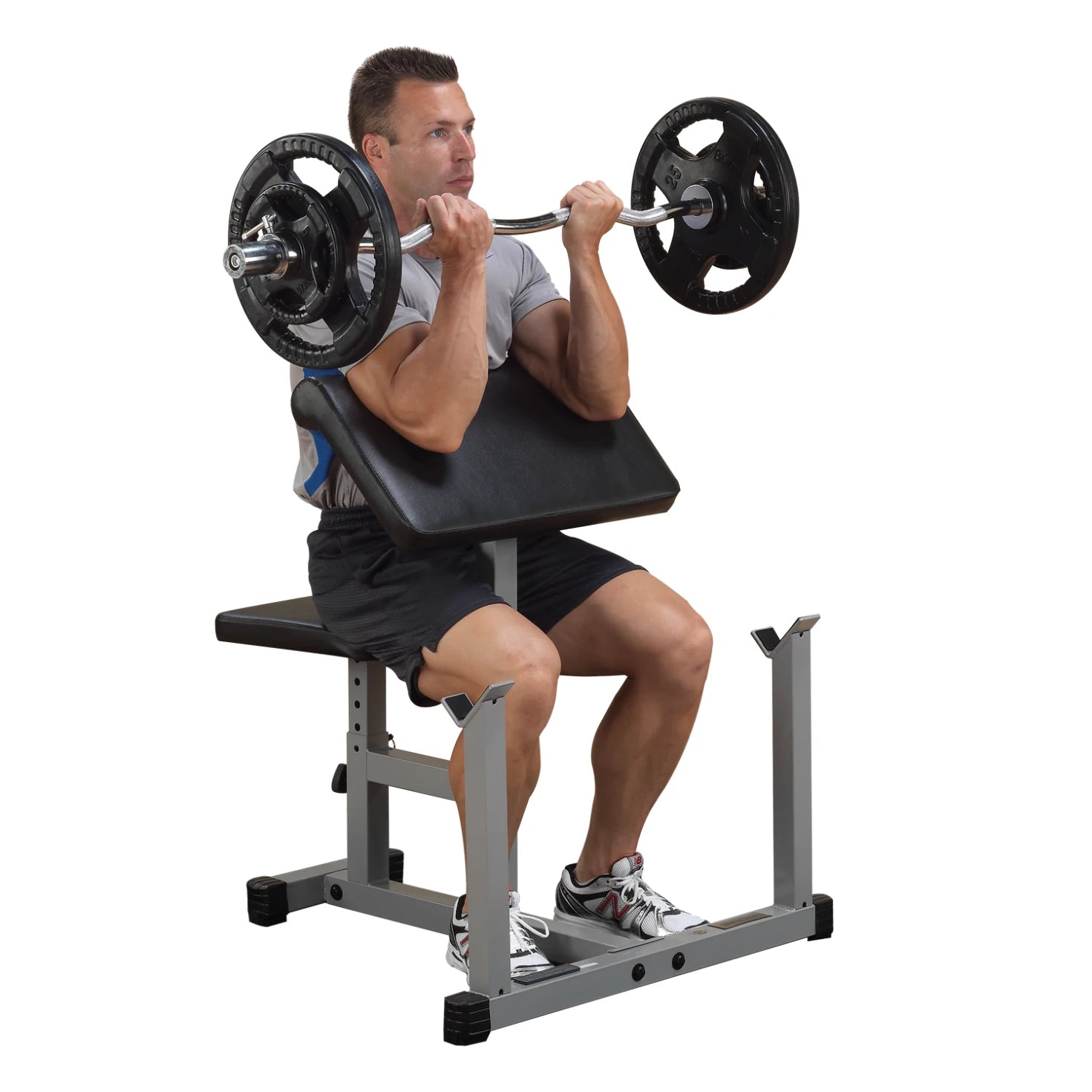 A man performing a seated shoulder press exercise with a barbell on a weight bench, showcasing proper form and focus during his workout.