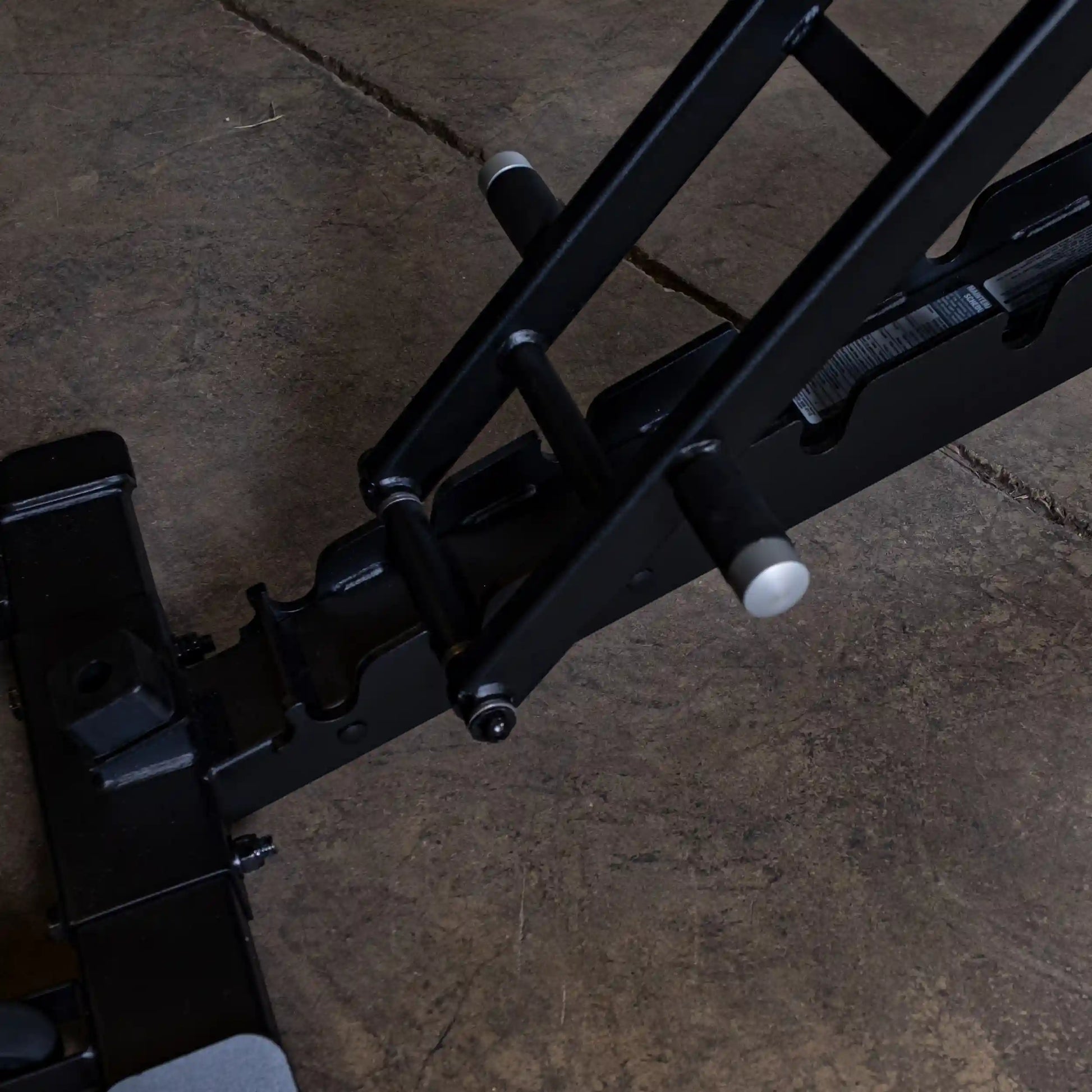 Close-up view of the adjustment mechanism of the Body-Solid Pro ClubLine Adjustable Bench SFID325, showcasing its sturdy construction and design.