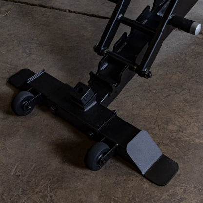 Close-up of the adjustable base and wheels of the Body-Solid Pro ClubLine Adjustable Bench SFID325, showcasing its sturdy design and mobility features on a concrete floor.