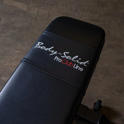 Close-up of the Body-Solid Pro ClubLine Adjustable Bench SFID325 showing the black padded surface with embroidered logo.