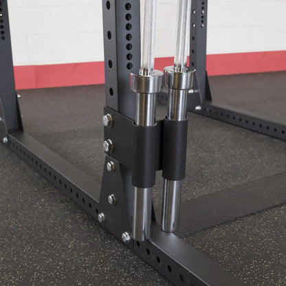 Close-up view of the Body-Solid Pro ClubLine Bar Holder Attachment SPRBHV, showcasing the attachment for securely holding Olympic bars on a weight rack.