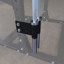 Body-Solid Pro ClubLine Bar Holder Attachment SPRBHV mounted on a fitness equipment frame, featuring two vertical cylindrical holders and secured with bolts.
