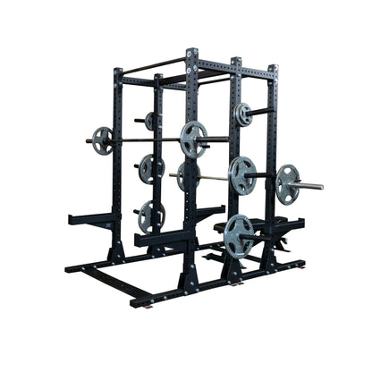 Body-Solid Pro ClubLine Commercial Double Half Rack Kit SPRDBLKIT with multiple weight plates and barbells, featuring a sturdy black metal frame.