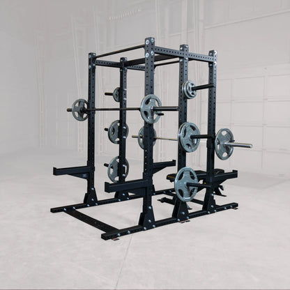 Body-Solid Pro ClubLine Commercial Double Half Rack Kit SPRDBLKIT in a gym setting, featuring a sturdy black metal frame with multiple weight plates attached for weightlifting exercises.