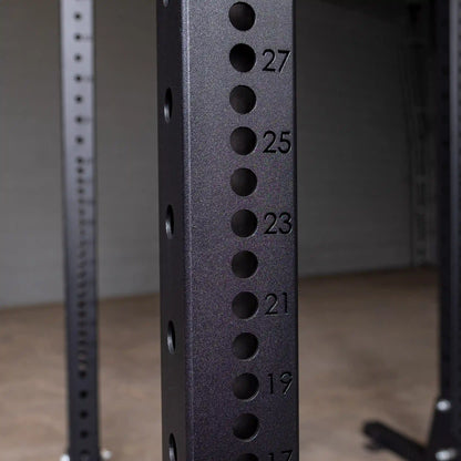 Close-up image of the Body-Solid Pro ClubLine Commercial Half Rack SPR500, showing the numbered adjustment holes on the vertical frame.
