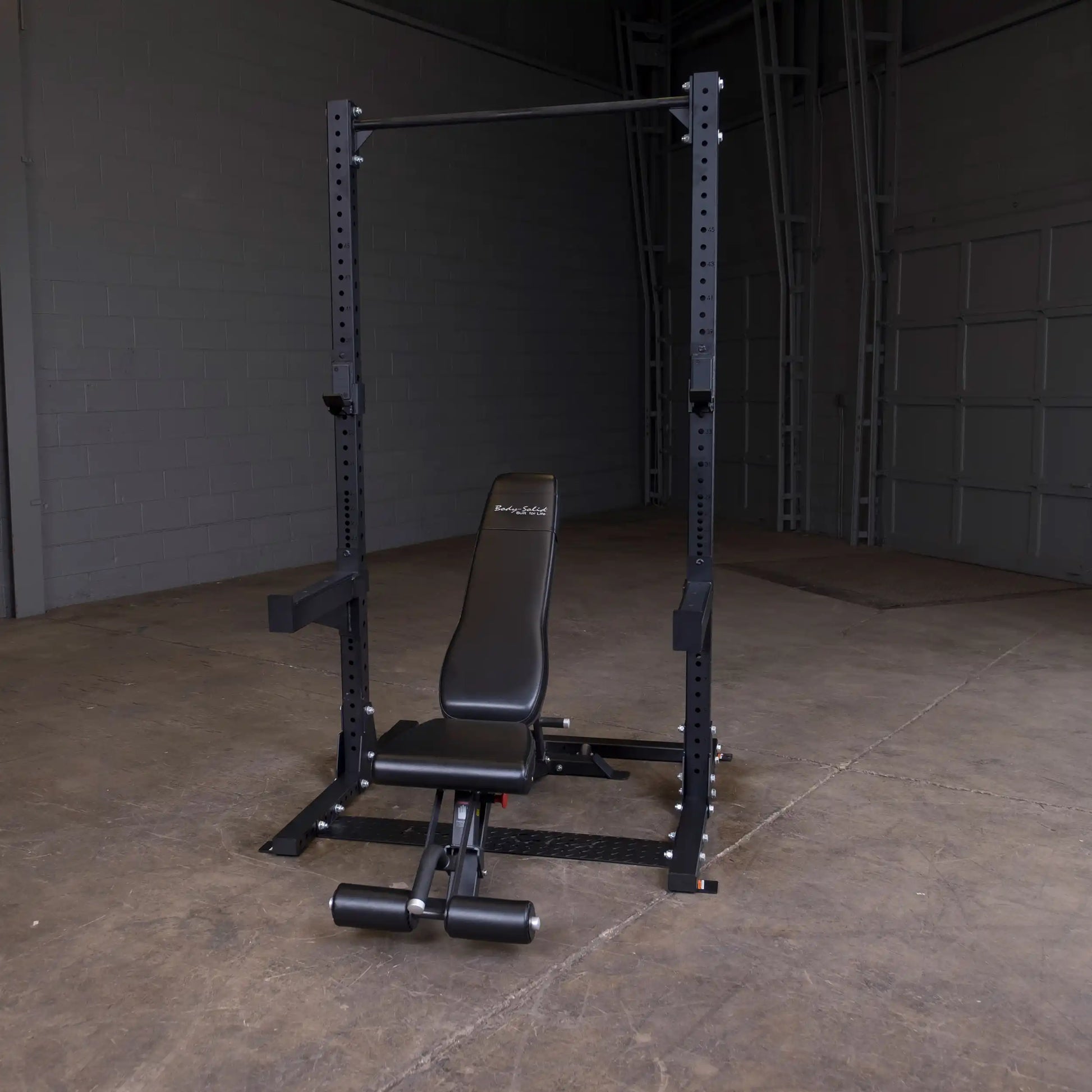 Body-Solid Pro ClubLine Commercial Half Rack SPR500 in an empty gym setting.