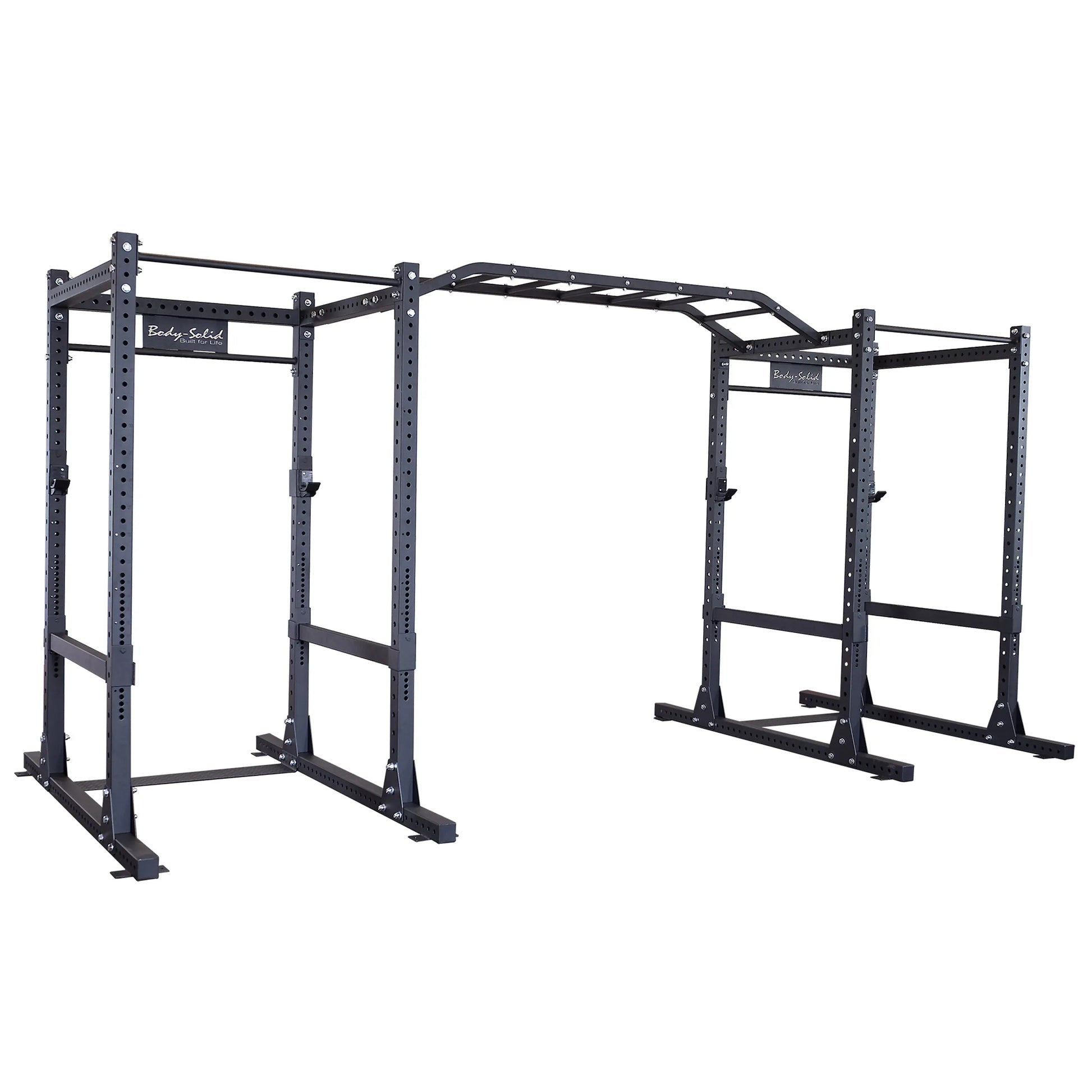 Body-Solid Pro ClubLine Double Commercial Power Rack SPR1000DB, featuring a sturdy black frame with multiple pull-up bars and adjustable components for versatile gym use.