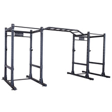 Body-Solid Pro ClubLine Double Commercial Power Rack SPR1000DB, featuring a sturdy black frame with multiple pull-up bars and adjustable components for versatile gym use.