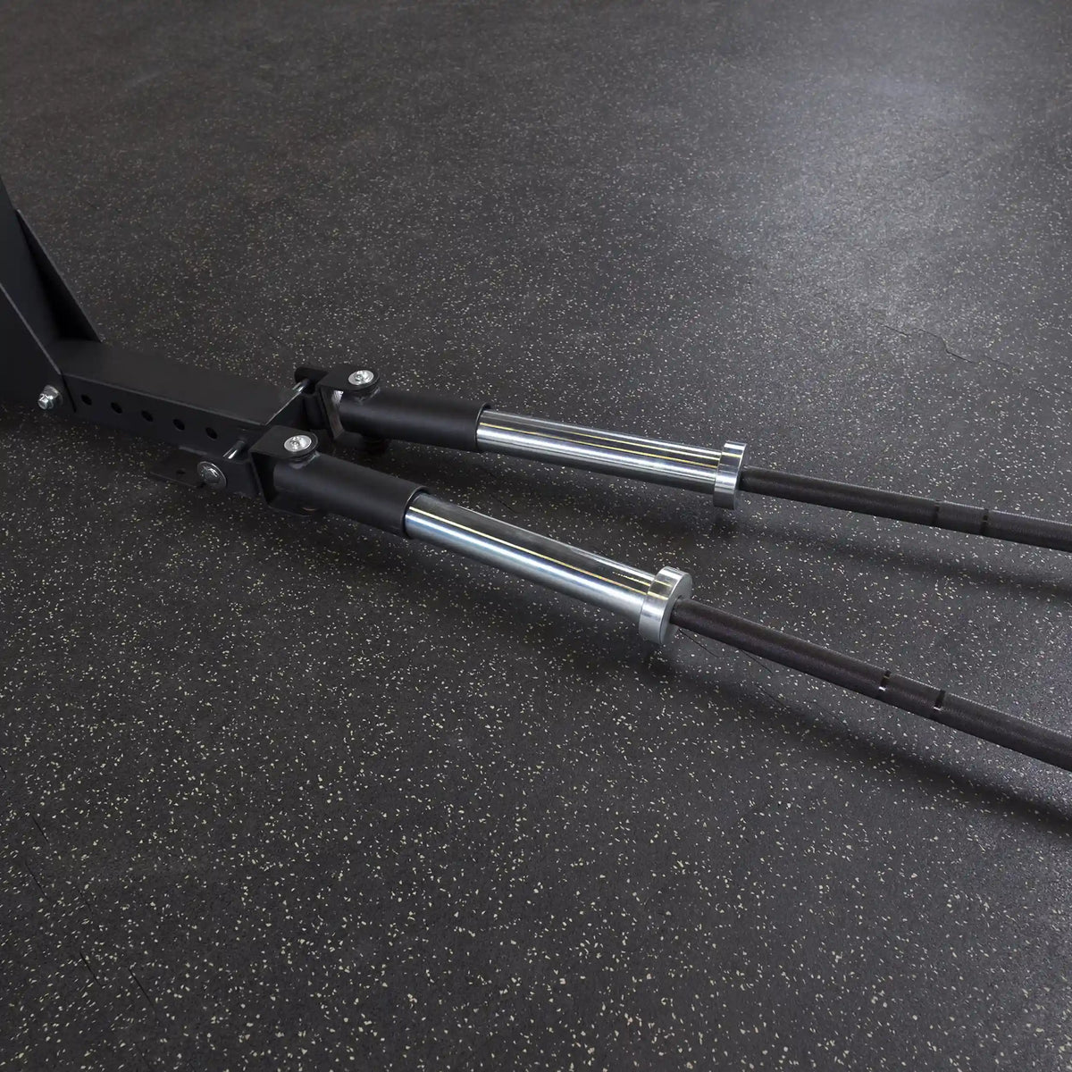 Close-up view of the Body-Solid Pro ClubLine Dual T-Bar Row Platform SPRTB, featuring chrome handles and a sturdy base on a textured gym floor.