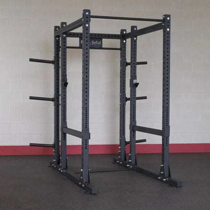 Body-Solid Pro ClubLine Extended Commercial Power Rack SPR1000BACK in a gym setting against a light-colored brick wall.