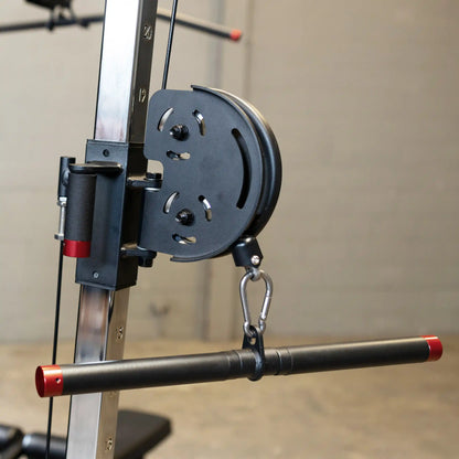 Close-up view of the pulley system and handle on the Body-Solid Pro ClubLine Four-Stack Gym S1000, showcasing its design and functionality for strength training.