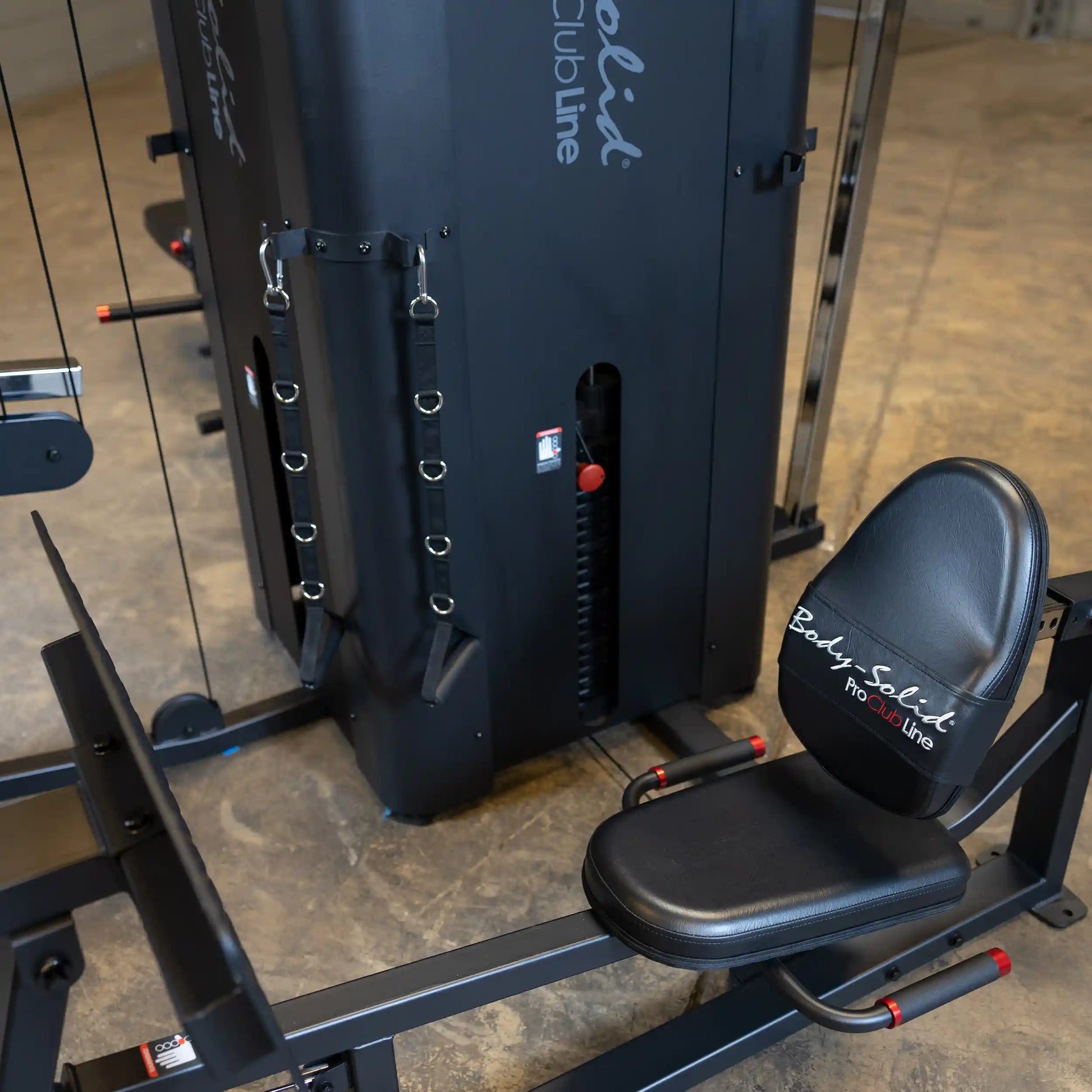 Image of the Body-Solid Pro ClubLine Four-Stack Gym S1000, featuring a black weight stack and a padded seat, designed for multi-functional strength training.