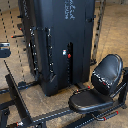 Image of the Body-Solid Pro ClubLine Four-Stack Gym S1000, featuring a black weight stack and a padded seat, designed for multi-functional strength training.