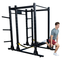 Man performing a hip thrust exercise using the Body-Solid Pro ClubLine Hip Thrust Attachment SPRHT with a kettlebell on a gym rack.