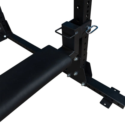 Close-up of the Body-Solid Pro ClubLine Hip Thrust Attachment SPRHT, showcasing its padded roller and attachment points on a weightlifting frame.