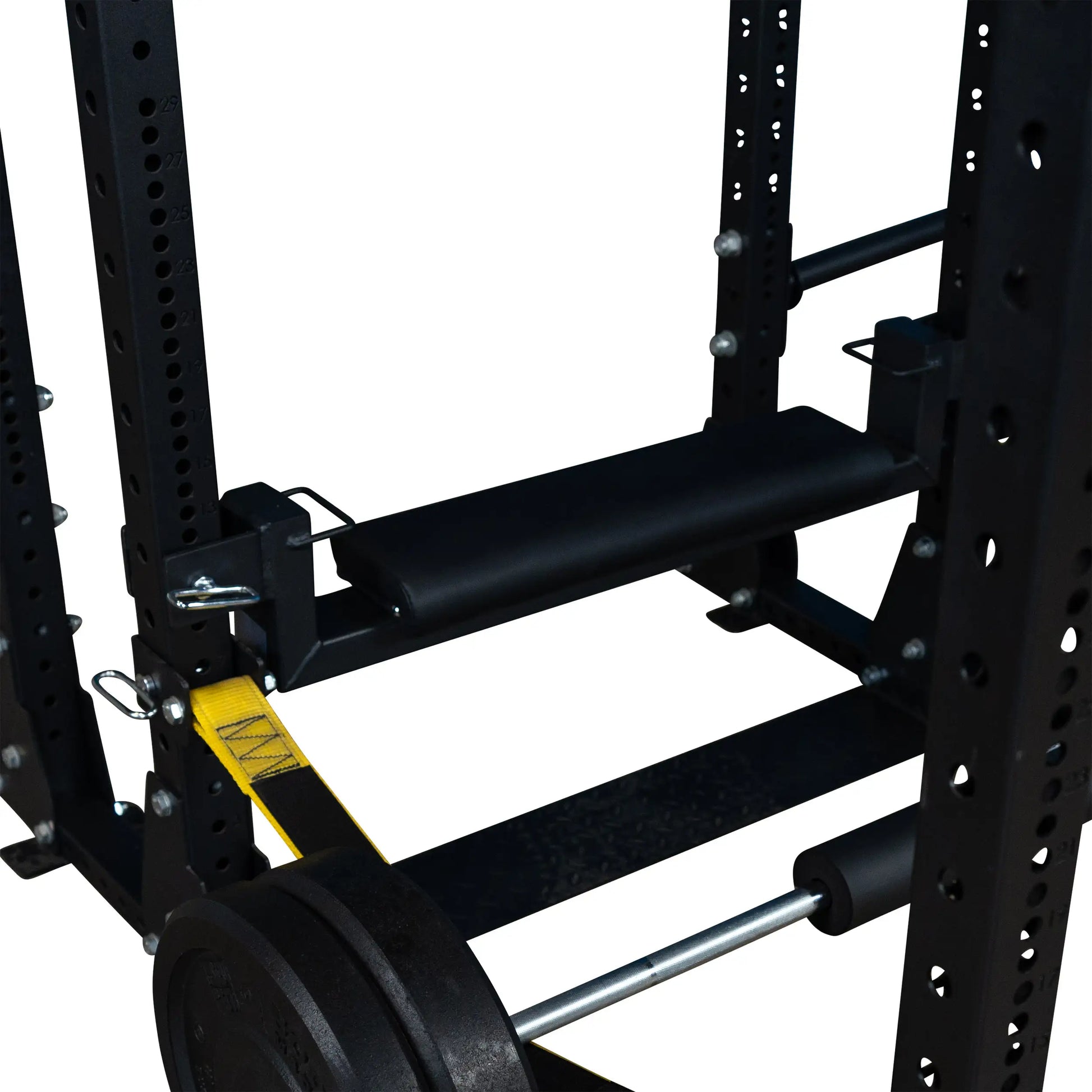 Close-up view of the Body-Solid Pro ClubLine Hip Thrust Attachment SPRHT, showcasing its supportive pad mounted on a weightlifting frame with Olympic weight plates.