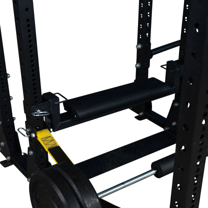 Close-up view of the Body-Solid Pro ClubLine Hip Thrust Attachment SPRHT, showcasing its supportive pad mounted on a weightlifting frame with Olympic weight plates.