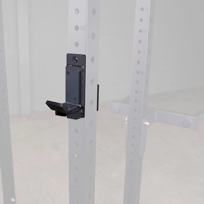Close-up of Body-Solid Pro ClubLine J-Cups SPRJC attached to a metal rack, showcasing the adjustable hook for secure weight placement.