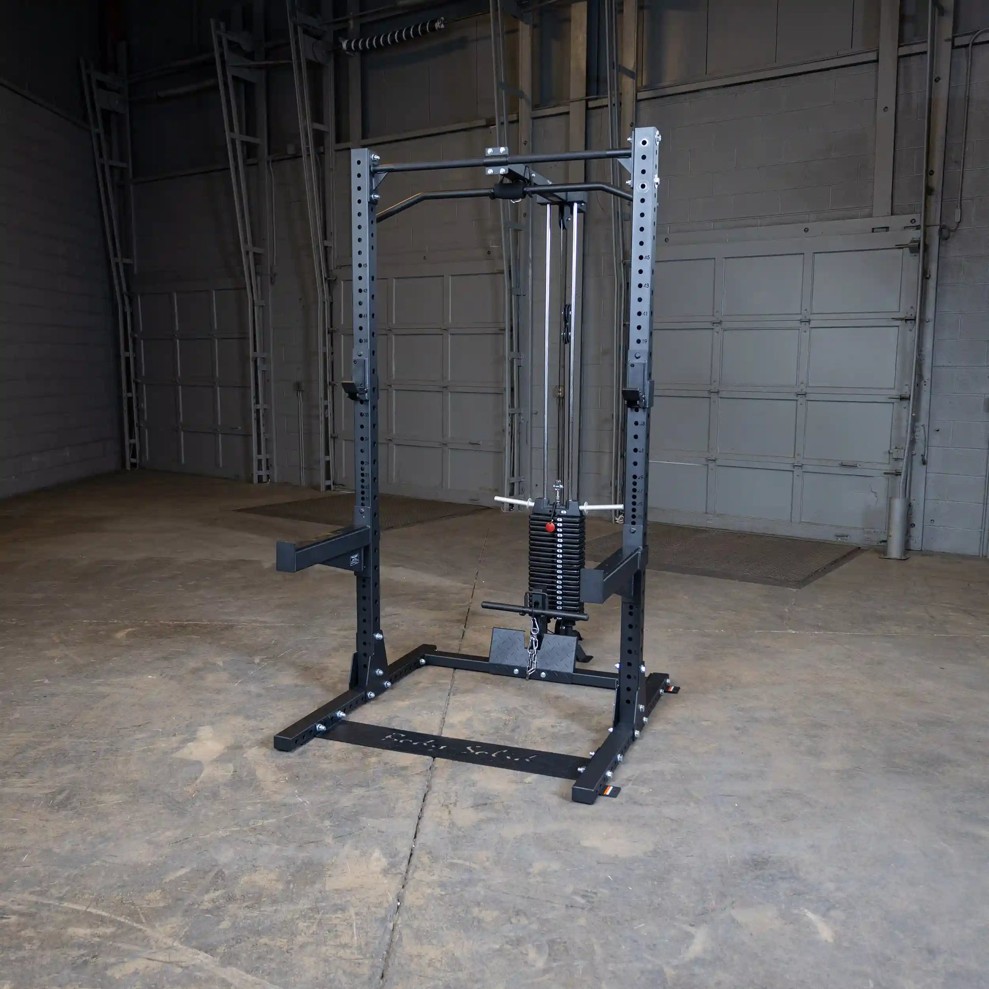 Body-Solid Pro ClubLine Lat Attachment SPRHLA displayed in an empty gym space, featuring a sturdy black frame and weight stack for lat exercises.