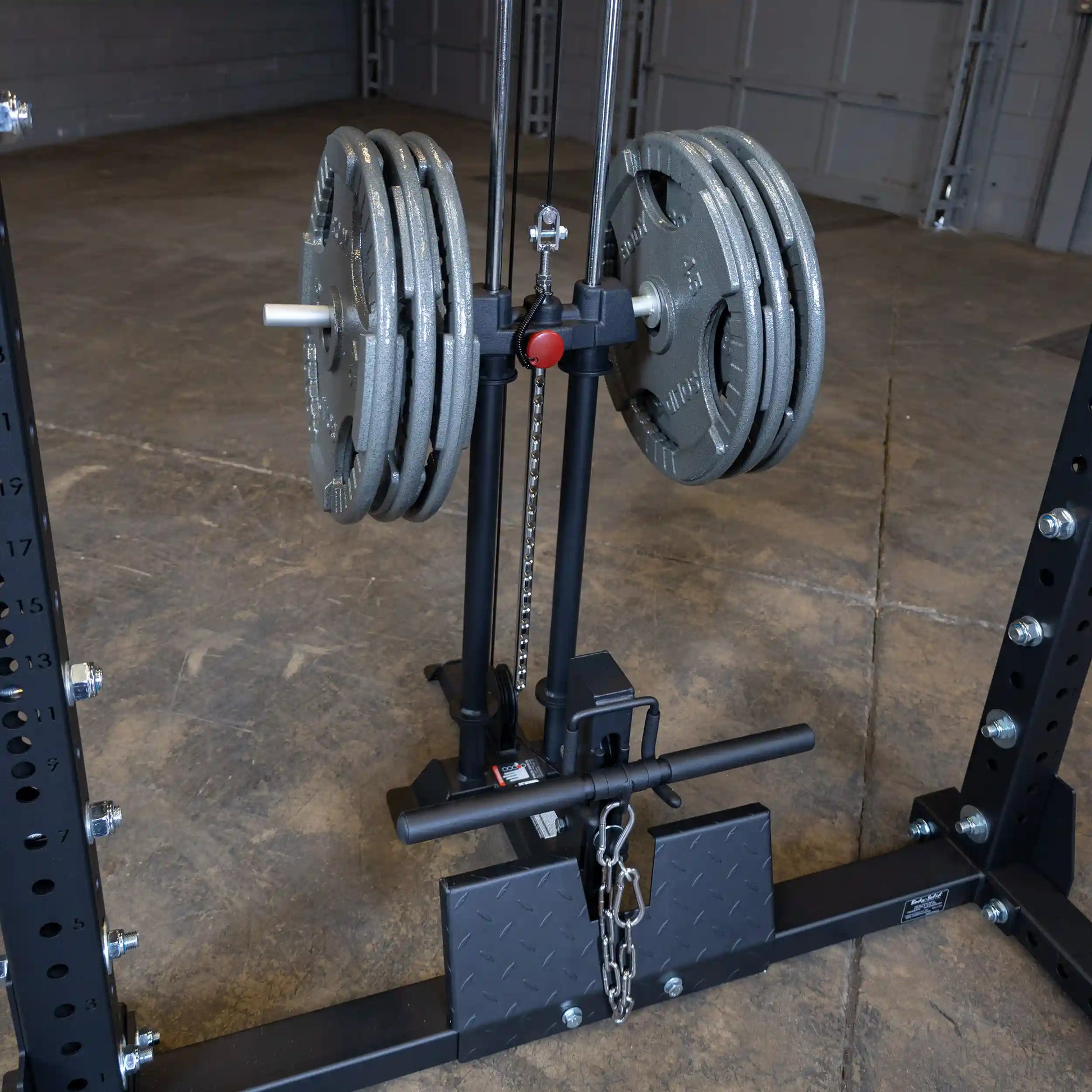 Body-Solid Pro ClubLine Lat Attachment SPRHLA with weight plates attached, positioned on a gym floor.